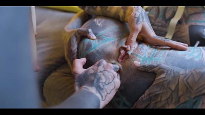 Burlesque tattoo beauty with big boobs gives anal fuck with strap-on