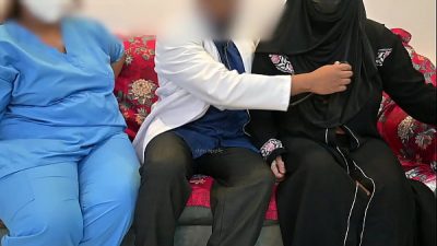 Doctor having fun with patient while nurse watch