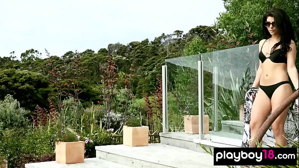 Petite brunette teen goddess Elle Georgia loves being naked in the pool