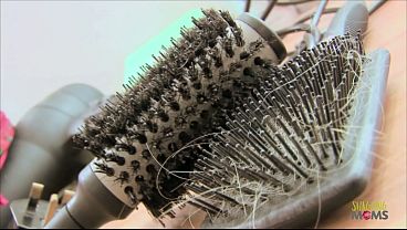 Sexy blonde milf Tia Lane is dressed up in black stockings and fucking hard in a black armchair.