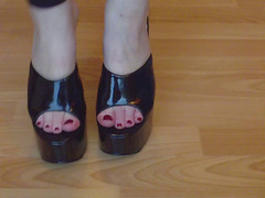 Ballbusting mistress in black platform mules